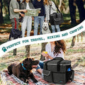 Pet Food Storage Container and Bowls in a camping setting with dogs and people enjoying the outdoors.