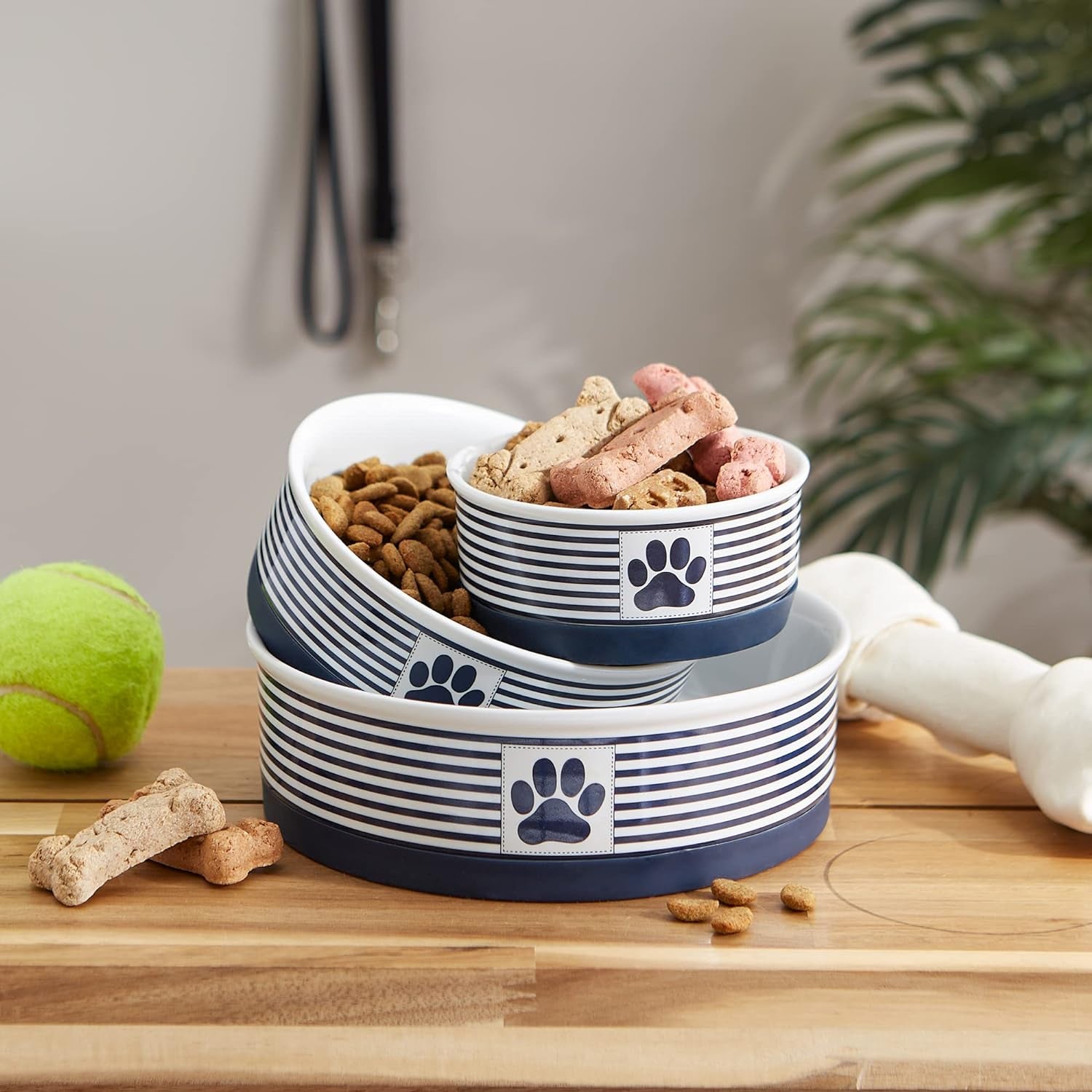 Ceramic Pet Bowl Set, striped design stacked, filled with dog treats and kibble, perfect for food and water use.