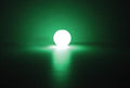 Glow in the dark dog ball glowing green in dark Chuckit Max Glow