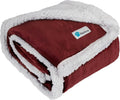 Red reversible sherpa dog blanket folded showing soft red fleece exterior and thick white sherpa lining for warmth and pet comfort
