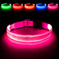 LED dog collar in bright pink color, enhancing visibility for nighttime safety during walks.