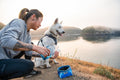 Collapsible Dog Bowl being filled with water outdoors, perfect for travel and hiking with pets.
