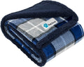 Blue plaid reversible sherpa dog blanket folded showing soft navy sherpa lining and patterned fleece exterior for pet comfort and furniture protection