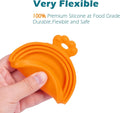 Silicone Pet Food Can Covers for Dogs and Cats shown in hand, highlighting their flexibility and premium silicone material.