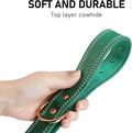Hand holding a Genuine Leather Heavy Duty Dog Collar showcasing its soft and durable cowhide material.
