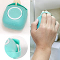 Dog bath brush with shampoo dispenser designed for easy grip and dispensing during pet baths.