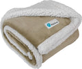 Beige reversible sherpa dog blanket folded showing soft tan fleece exterior and thick white sherpa lining for warmth and comfort