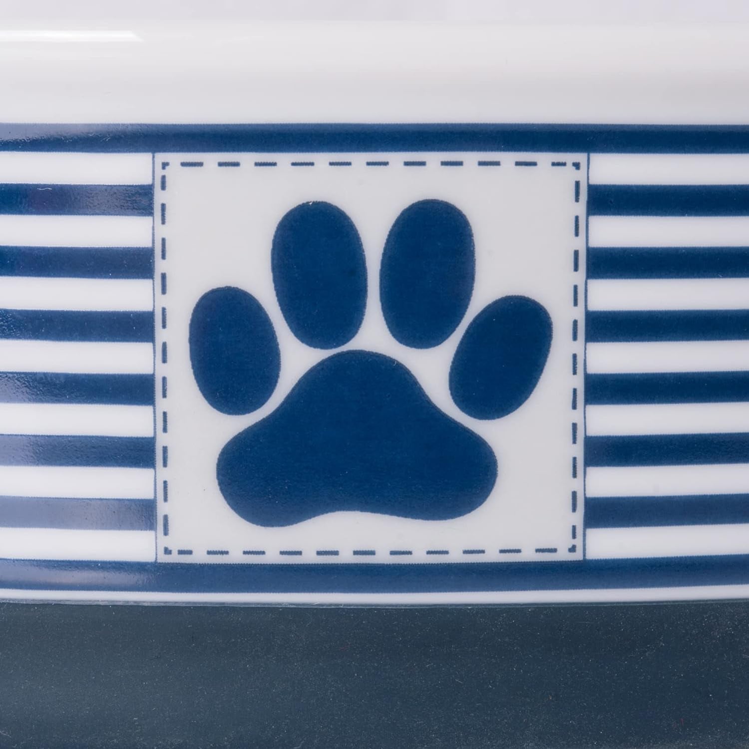 Ceramic Pet Bowl Set featuring a paw print design on a striped background for stylish pet feeding.