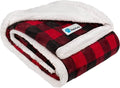 Red and black plaid reversible sherpa dog blanket folded showing soft white sherpa lining and warm fleece exterior for pet comfort