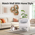 Self-Cleaning Litter Box in a stylish living room with a cat nearby, matching home decor.